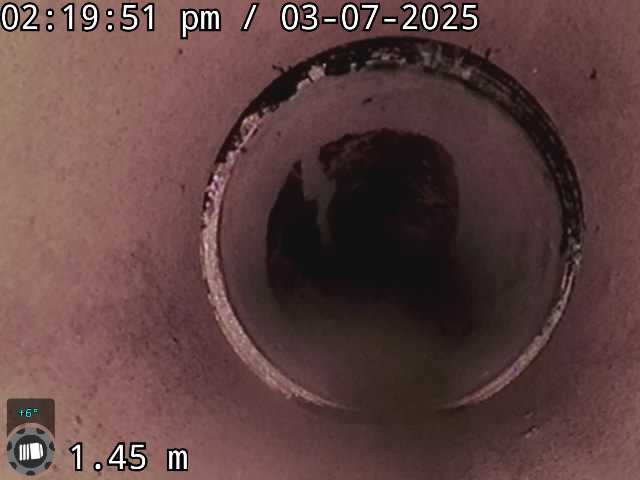 A cleared section of sewer pipe on CCTV after the tree roots in the drain were cut